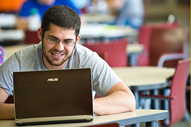 photo of a student using a laptop