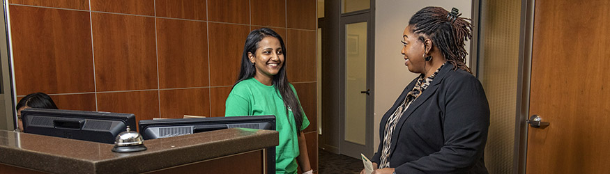 photo of a student employee and staff member